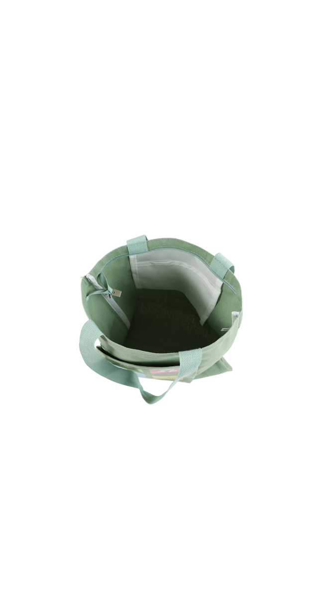 Mint green canvas tote bag interior with stitched seams and matching fabric handles