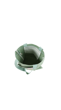 Mint green canvas tote bag interior with stitched seams and matching fabric handles