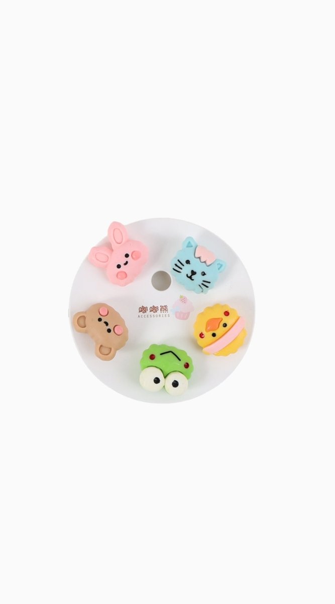 Assorted animal enamel pins with cute faces on a circular backing