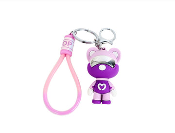 Purple silicone astronaut bear keychain with pink loop strap and silver keyring