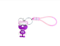 Purple astronaut bear silicone keychain with pink strap and silver clasp keyring