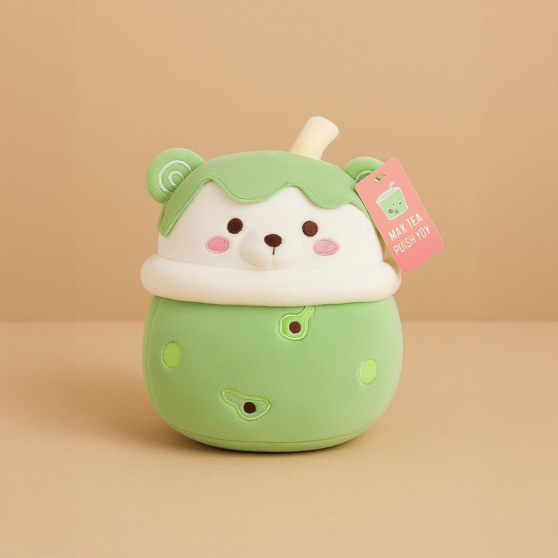 Avocado plush toy with smiling face, green and white fabric, tag attached
