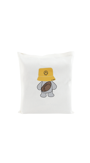 White canvas tote bag with cute bear wearing yellow bucket hat graphic