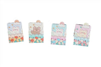 Compact mirrors shown from multiple angles with pastel bear and cloud cover designs.