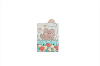 Compact mirror cover with bear face, pastel clouds, and colorful flowers and hearts.
