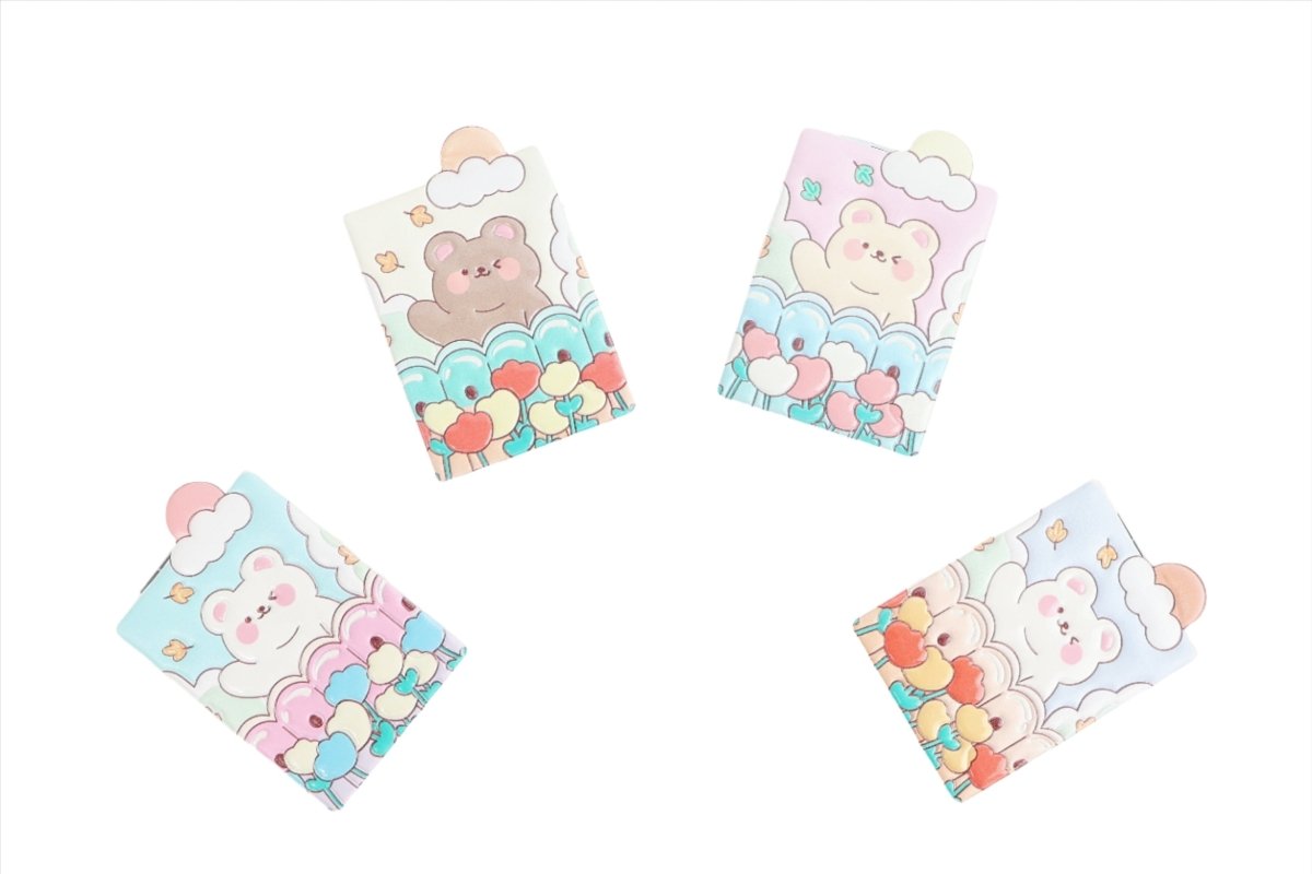 Set of compact mirrors with pastel bear, cloud, and heart designs on covers.