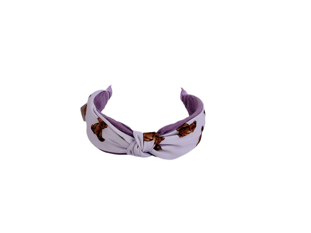 Knotted printed hairband in lavender with brown motif, knotted center bow