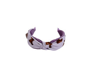 Knotted printed hairband in lavender with brown motif, knotted center bow