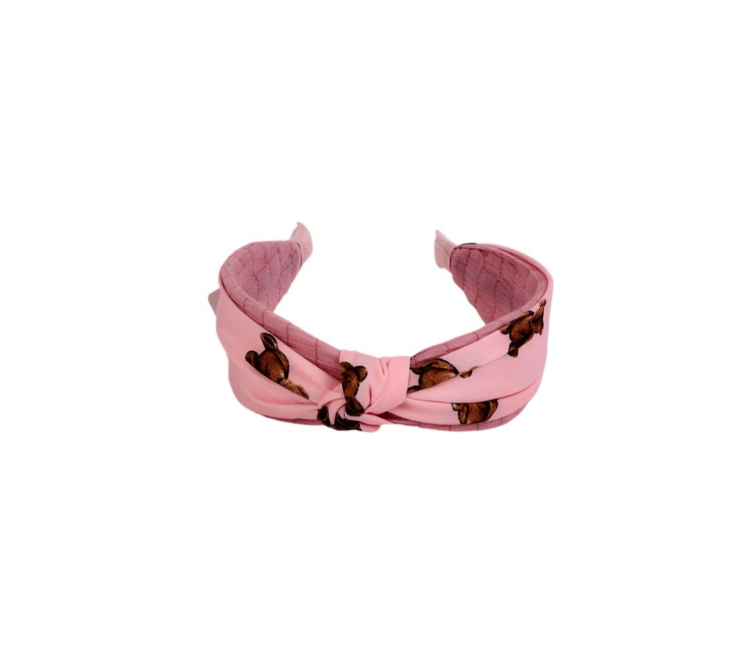 Knotted printed hairband in soft pink with brown motif, knotted front