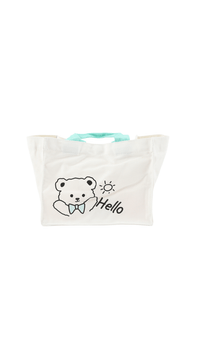 Cream canvas tote bag with bear graphic and 'Hello' text, teal handles