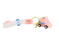 Pink and blue keychain with gold ring, clear strap, and toy car charm
