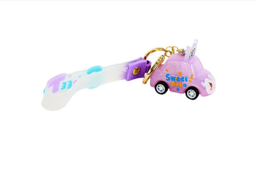 Purple keychain with gold ring, lanyard strap, and small toy car charm
