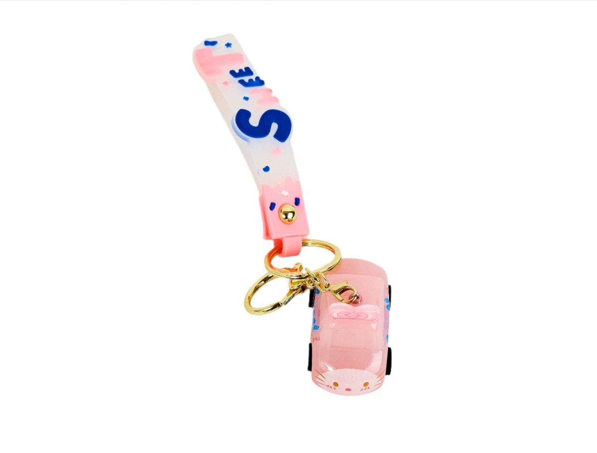 Pink keychain with gold ring, vertical “Sweet” strap, and small toy car charm