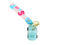 Turquoise keychain with lobster clasp, clear charm case, and pink S lettering