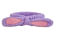 Purple plush rabbit-knot hair band with pink-lined ear pads