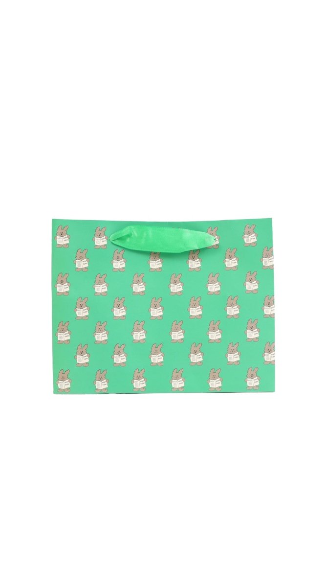 Green bunny gift bag with repeating bunny icons and rope handle