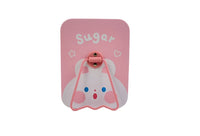 Bunny hand mirror with pink backing, white frame and smiling bunny graphic