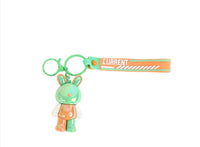 Bunny keychain with orange strap and green rabbit charm, with key ring.