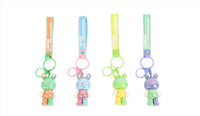 Assorted bunny keychains with colorful straps and rabbit charms, four styles shown.