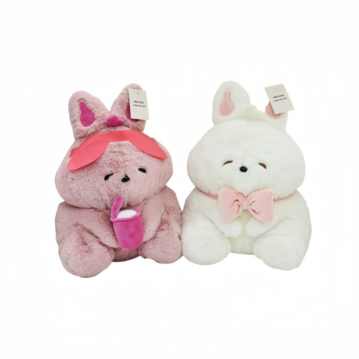 Pair of bunny plush toys: gray with pink bow and white with pink bow, tags on