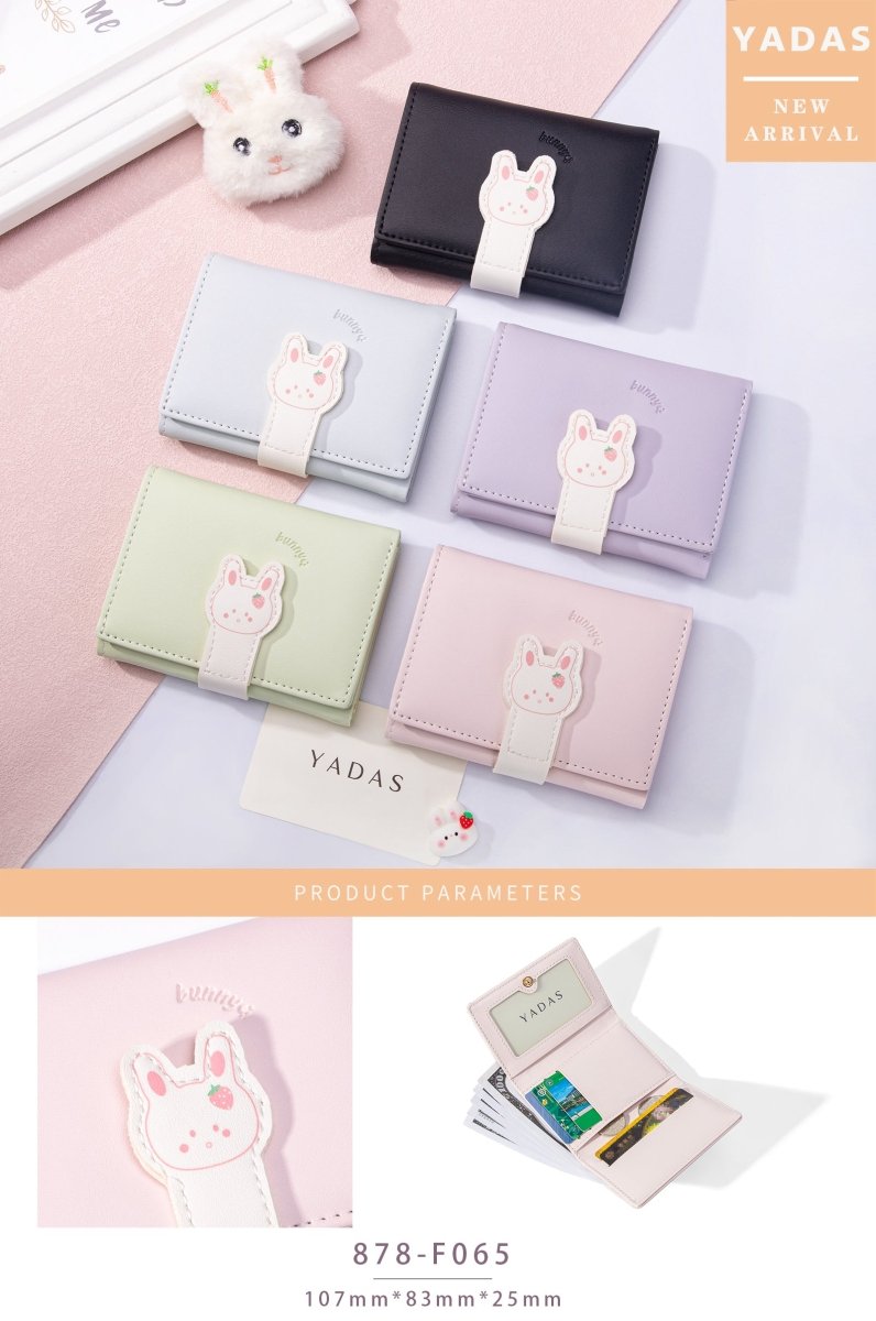 Assorted compact bunny wallets in pastel colors, each with a bunny patch