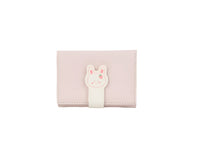 Compact bunny wallet in pale pink with a white bunny patch on the front