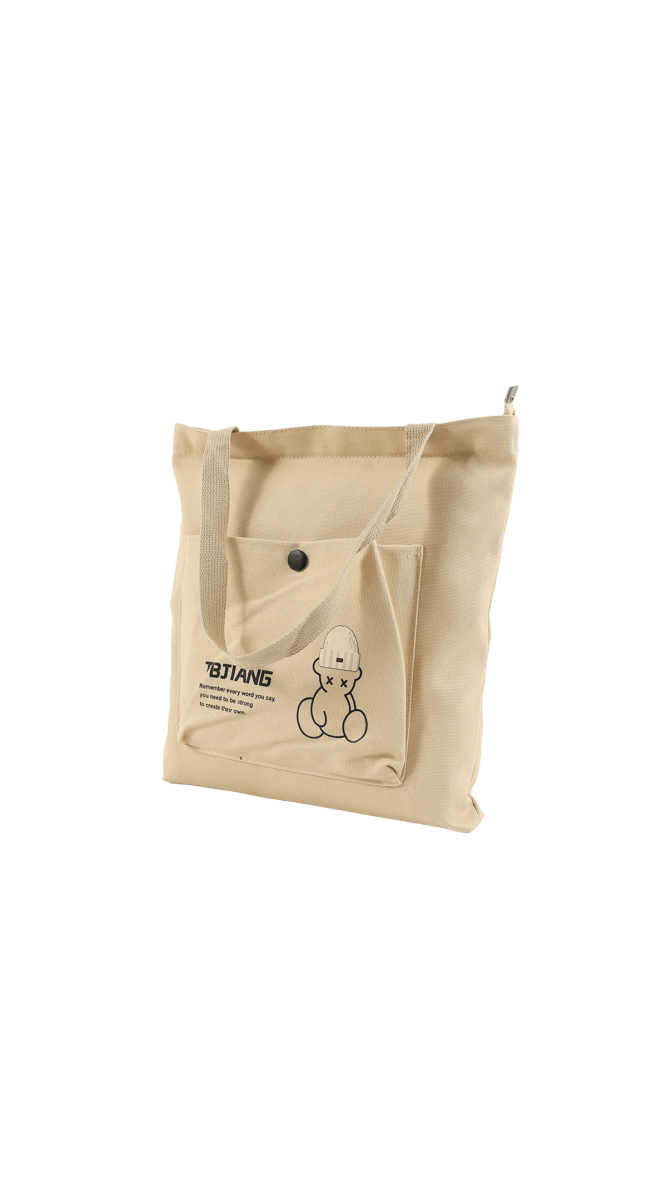 Light beige canvas tote bag with bear cartoon patch and front pocket