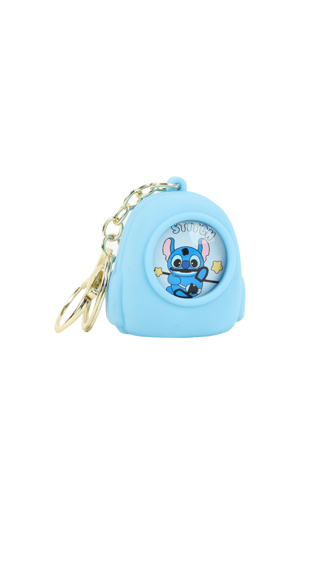Light blue cartoon backpack keychain with front character graphic and metal keyring chain