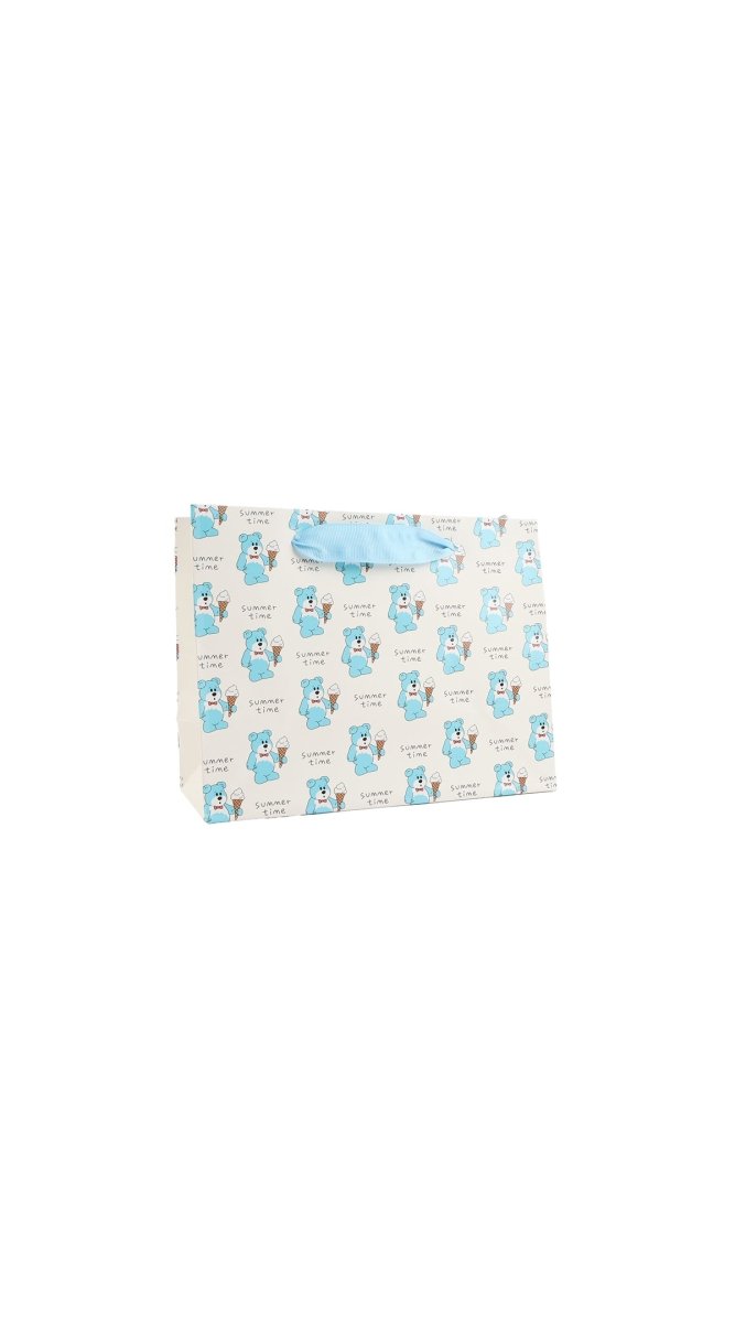 Blue cartoon gift bag with top green handle and repeating animal pattern