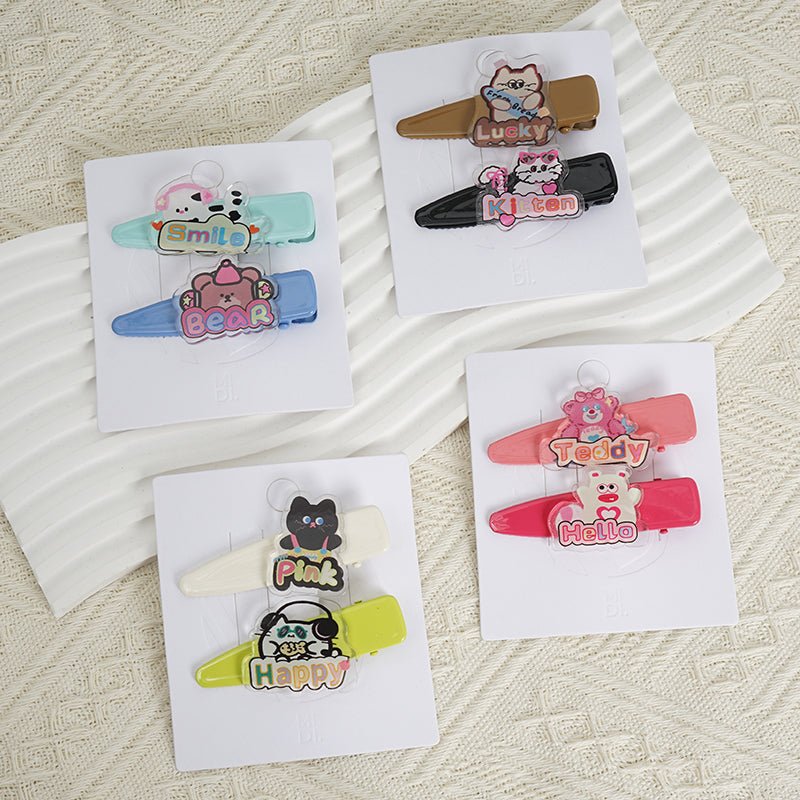 Assorted animal-themed hair clips on display cards in multiple colors
