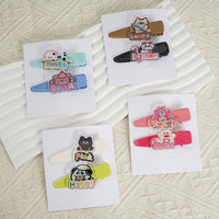 Assorted animal-themed hair clips on display cards in multiple colors