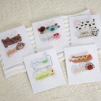 Assorted cartoon hair clips on retail display cards