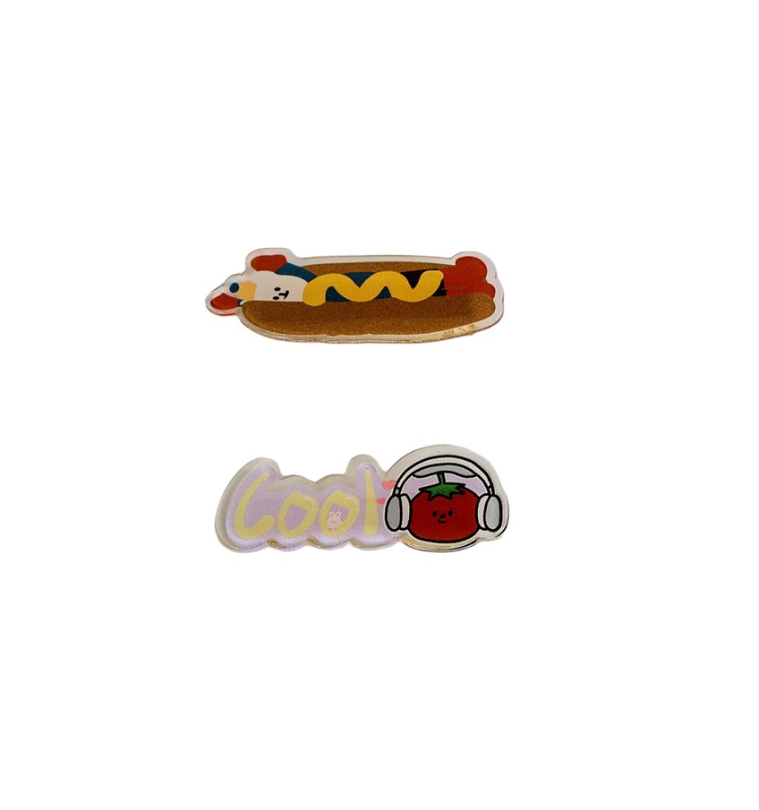 Cartoon hair clips: brown hotdog clip and white "Cool" character clip