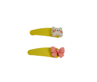 Yellow kids hair clips with cat face charm and pink bow