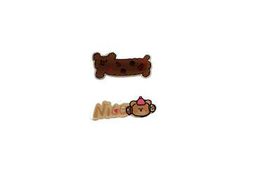 Cartoon hair clips: brown bone design and white character design
