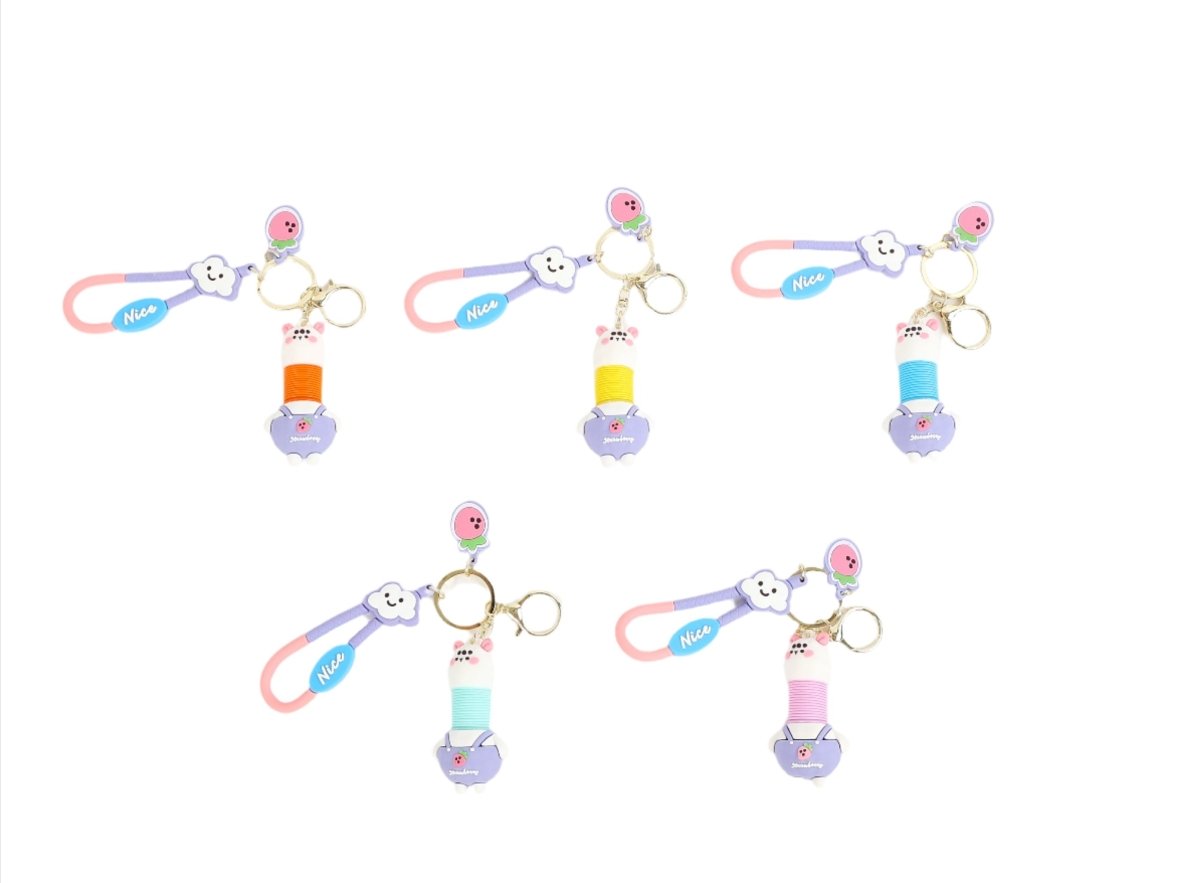 Set of rabbit cartoon keychains with mixed charms, pink and blue accents, gold rings