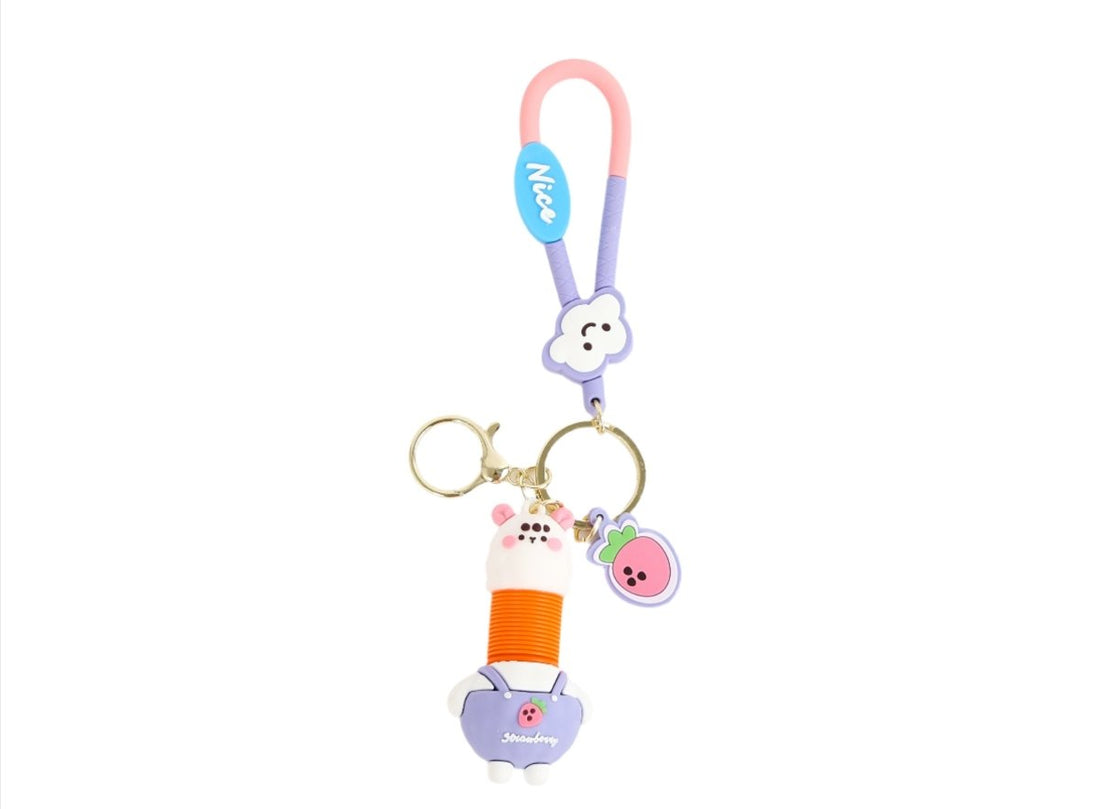 Rabbit cartoon keychain with pink loop, blue tag, orange spiral and hanging pig charm