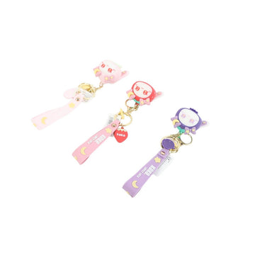Cartoon fruit series keychains with straps, pink and purple figures on clips.