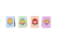 Four closed compact mirrors with cute cartoon faces on pastel square covers.