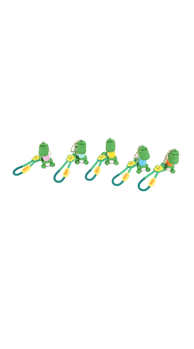 Set of silicone cartoon crocodile keychains with teal loops and small hanging charms