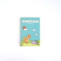 Dinosaur A6 coil notebook, light blue cover with orange dinosaur, clouds, and plants.