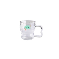 Clear glass coffee cup with green animal motif