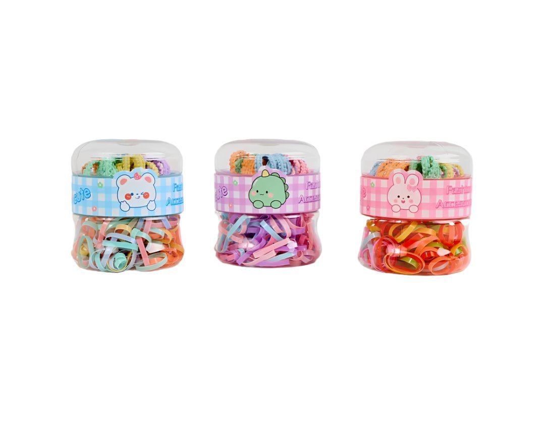 Set of plastic containers with colorful hair ties and bands