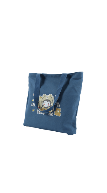 Blue kids canvas tote bag with cartoon bear graphic and small star accents
