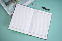 Open notebook with two ruled pages and green border