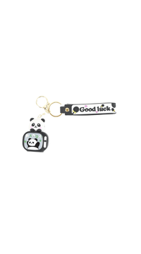Panda keychain with small panda charm, gold ring, black strap reading 'Good luck'.