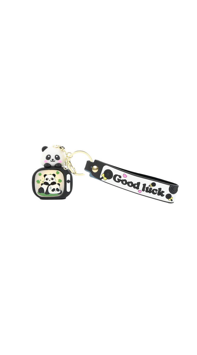 Panda keychain with backpack charm, gold ring, black strap with 'Good luck' print.