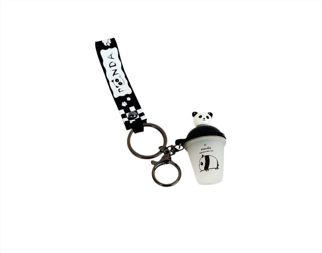 Panda keychain with black ribbon strap and white container with panda face