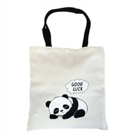 White canvas tote bag with panda graphic and 'GOOD LUCK' speech bubble, buttoned top