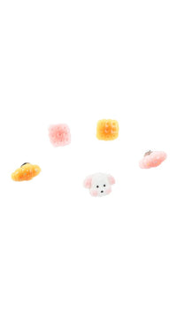 Six pastel enamel pins featuring a white dog and assorted pastries
